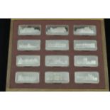 A cased set of Birmingham Mint silver ingots depicting the royal palaces,
