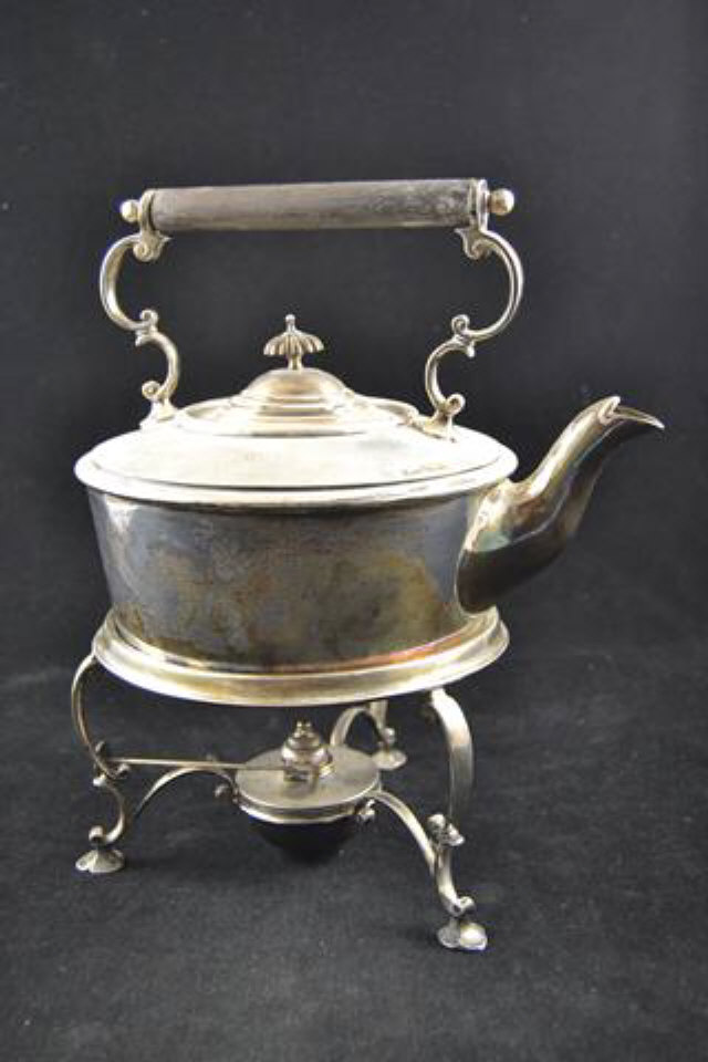 A Goldsmiths & Silversmiths Company silver tea kettle on spirit burner stand,