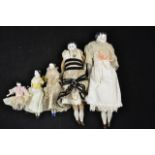 A collection of five china headed dolls, largest 29cm, smallest 8.