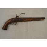 A 19th century continental flintlock pistol, fluted walnut stock,