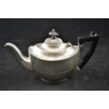 A silver batchelor's teapot of half fluted design and wooden handle, Birmingham 1901,