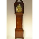 A late 18th/early 19th century oak and mahogany longcase clock with arched brass dial,