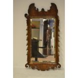 An 18th/early 19th century walnut pier mirror, some fretwork missing, leaf carving to sides,