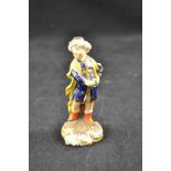 A Bloor Derby miniature figure of Turk with bouquet of flowers on shell base,