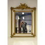 A 19th century Venetian style giltwood and gesso mirror, four bevelled mirror side panels,