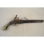 A 19th century Indo-Persian flintlock pistol, brass mounted pommel and trigger guard,