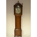 A late 18th/early 19th century oak longcase clock, arched painted dial with date aperture,