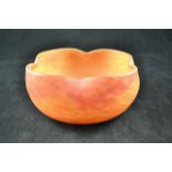 A Daum Nancy glass bowl, mottled orange in colour,