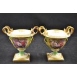 A pair of Flight, Barr & Barr green ground vases, entwined snake gilt handles,