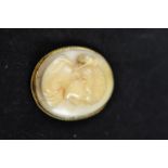 A 9ct gold mounted ivory cameo brooch carved with the bust of a classical style lady in profile -