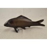 An oriental bronze carp, inscribed to base - L25cm CONDITION REPORT good condition