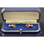 A pair of 9ct gold ladies cabouchon garnet cufflinks in a presentation box with spare links