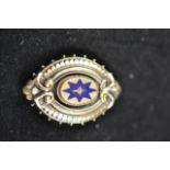 A Victorian yellow metal brooch with blue enamel star decoration set with central seed pearl - 4.