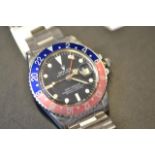 A Rolex Oyster Perpetual GMT-Master gentleman's wristwatch, red and blue bezel, black dial, Oyster