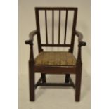 An early 19th century fruitwood child's armchair with drop in seat - H59cm