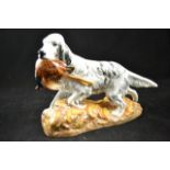 A Royal Doulton figure of a hunting dog with pheasant, HN2529 - L29cm CONDITION REPORT good