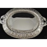 A mid 20th century silver plated oval two handled tray with bevelled mirror centre, now converted to