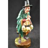 A Royal Doulton figure - The Mask Seller, HN2103 - H22cm CONDITION REPORT good condition - not a