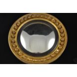 A 19th century convex mirror with reeded slip and gilt ball frame - diam 46cm CONDITION REPORT