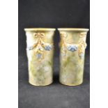 A pair of Royal Doulton stoneware cylindrical vases with garland decoration - H15cm CONDITION REPORT