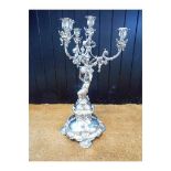 A mid Victorian silver four light candelabrum, R & S Garrard & Co, Panton St. London, cherub