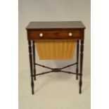 An early 19th Century inlaid rosewood work table, fitted drawer with ivory handles, slide with