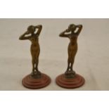 Two early 20th century miniature bronzes depicting nude female figures, mounted on composition bases