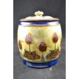 A Royal Doulton stoneware biscuit barrel with stylized floral decoration - H15cm CONDITION REPORT