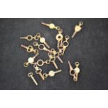 A collection of eighteen pocket watch keys of various makes