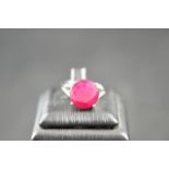 A 10k white gold ring set with solitaire ruby - size R 1/2 - diameter of stone 1.3cm. CONDITION