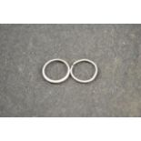 A platinum wedding band - size M, together with one other platinum ring (band cut) - approx total