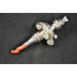 A Victorian silver baby's rattle of conventional form, having bells and coral teether, maker