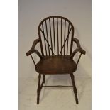 An early 20th century oak Windsor stick back armchair, the timber from HMS Foudroyant, bearing