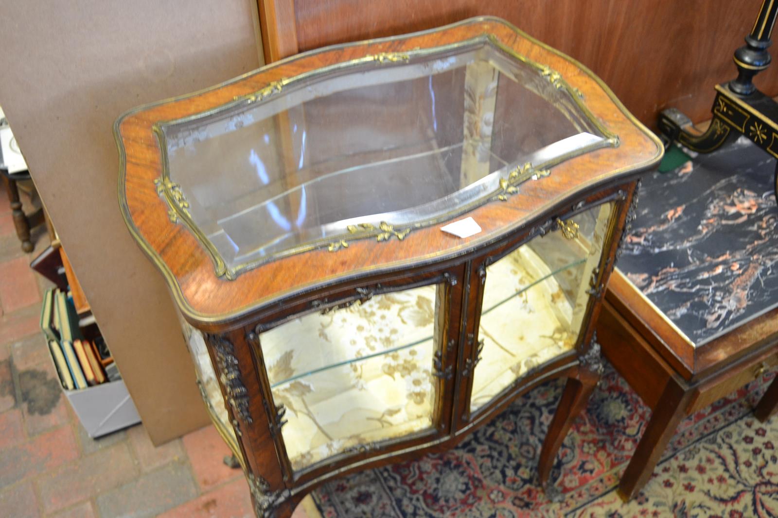 A 19th Century French kingwood bijouterie cabinet, all over decorated with floral and scroll gilt