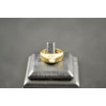 An 18ct gold ring set with solitaire diamond - size I, approx gross weight 6.9g, inscribed A L to