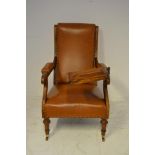 A Victorian walnut framed reading chair, reading slope, brown leather upholstery. CONDITION REPORT