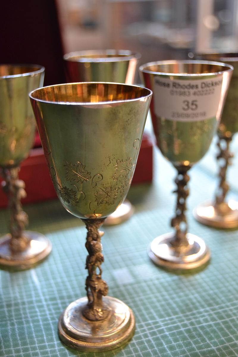 A boxed set of six Eastern European .925 goblets with cherub supports, gilt interiors - H11cm -