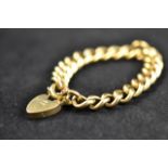 An 18ct gold Albert chain bracelet with heart padlock clasp and safety chain - approx total weight