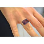 An 18ct white gold ring set with square cut amethyst with diamonds to corners, size M 1/2. CONDITION