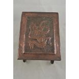 An early 20th century Arts and Crafts style hammered copper trivet with dragon decoration - W31cm