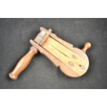 A vintage beech wooden clapper. CONDITION REPORT in working order, slight woodworm