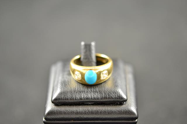 An 18ct gold ring set with oval cabochon turquoise and two diamonds - size L, approx gross weight