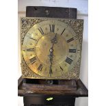 An 18th/early 19th Century pine longcase clock, 30cm square brass dial with urn spandrels,