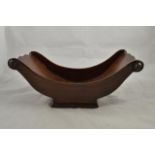 An early 19th Century style mahogany cheese cradle with applied bosses - L40cm. CONDITION REPORT