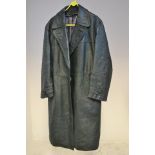 A green leather great coat with grey lining, size 48