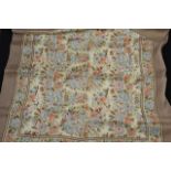 A Liberty silk scarf, taupe border, central panel with floral design in muted green, blue and peach,