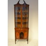 A late 19th/early 20th Century bow fronted mahogany display cabinet, painted with garlands and