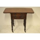 An early 19th Century rosewood work table, drop flaps, two drawers, reeded legs on brass casters -