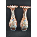 A pair of Japanese imari vases with crimped, flared tops, panels depicting birds, marks to bases -