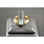 A 9ct gold amethyst and blue topaz 'reverso' ring with diamond set shoulders - size O 1/2, approx